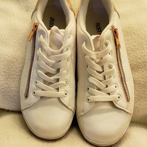 white sneakers with gold zipper